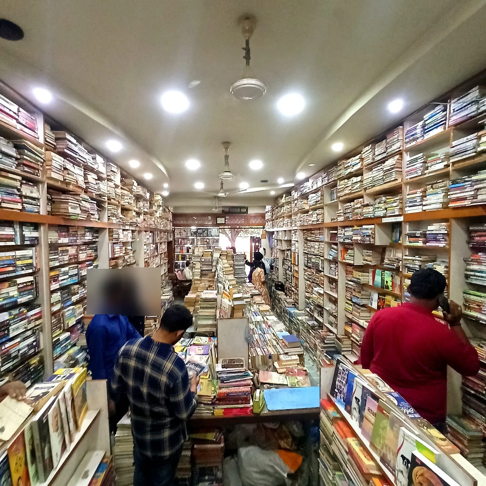 Customers browsing the aisles at Best Book Centre, Abids