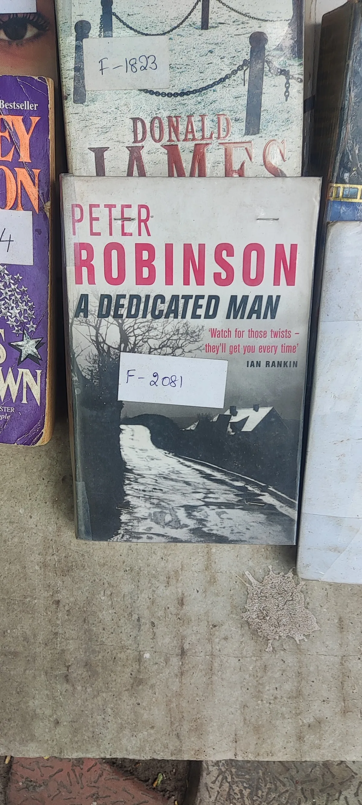 Close-up of secondhand books on the shelf